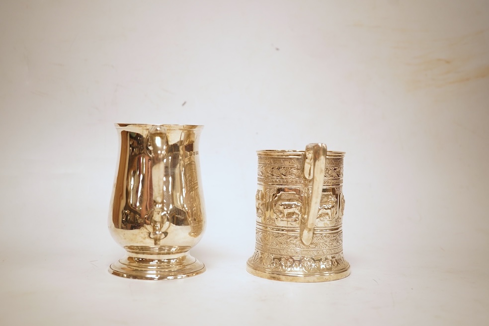 A George III silver baluster mug, Peter & Ann Bateman?, London, 1797, height 10.6cm, together with a late Victorian embossed silver christening mug, Glasgow, 1893, 12.2oz.